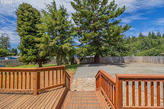 wooden terrace with a patio