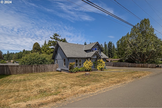 view of front of home with a front lawn