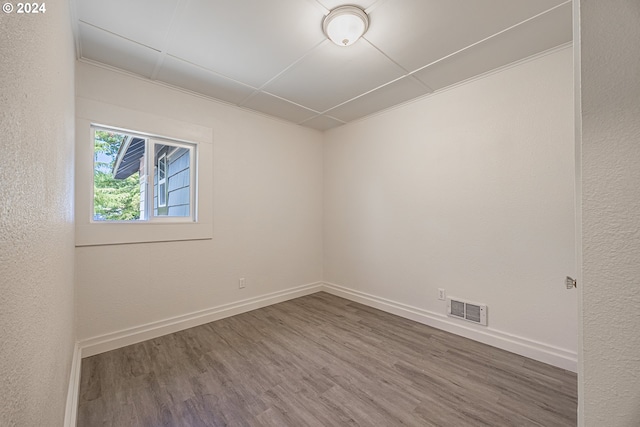 unfurnished room featuring wood-type flooring