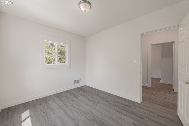 unfurnished room featuring wood-type flooring