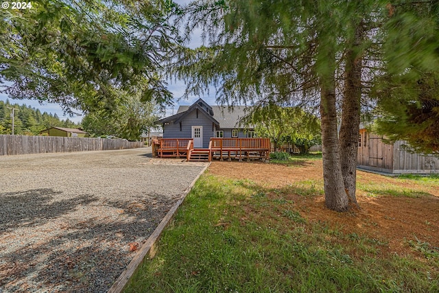 back of property featuring a deck