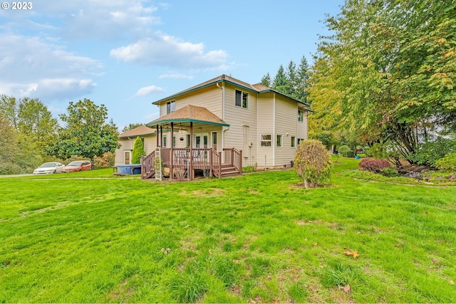 back of house featuring a yard