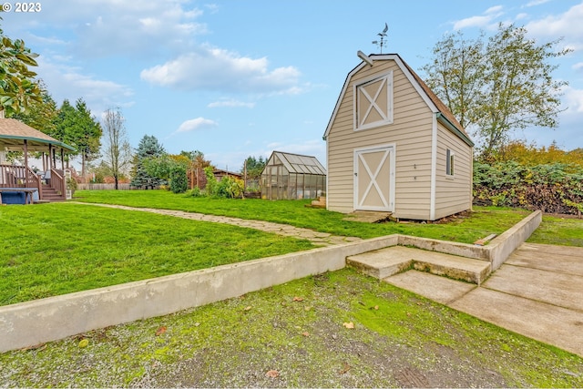 view of outdoor structure featuring a lawn