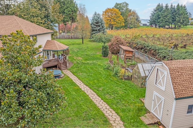 view of yard with an outdoor structure and a wooden deck