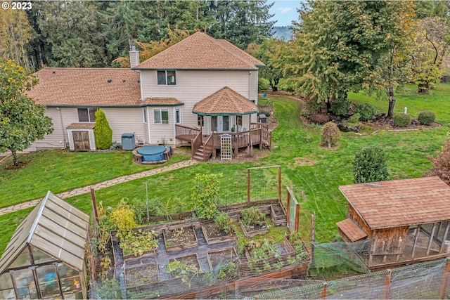 back of house featuring an outdoor structure, a wooden deck, and central air condition unit