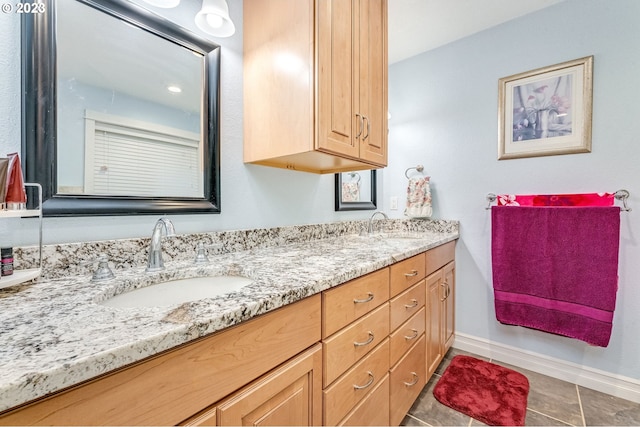 bathroom with tile patterned flooring and vanity