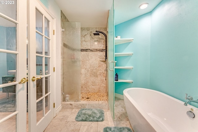 bathroom featuring french doors and separate shower and tub