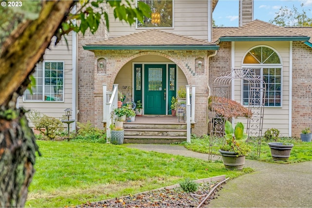 property entrance featuring a yard