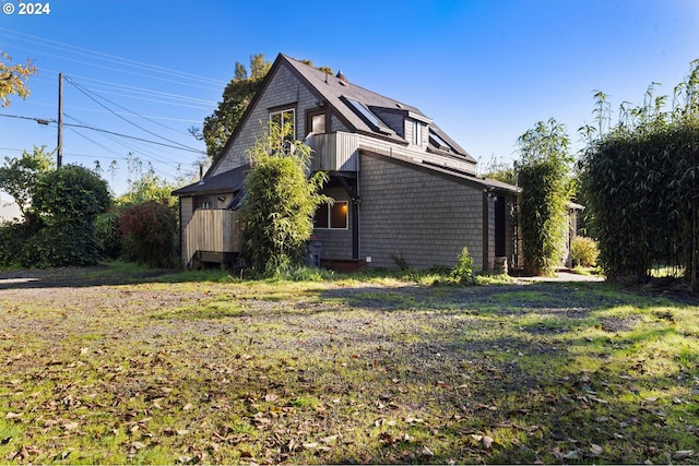 view of home's exterior featuring a lawn