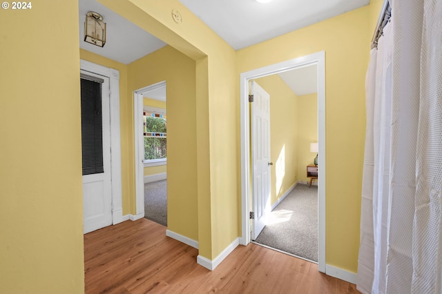 hall with light hardwood / wood-style floors