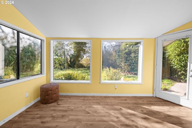 unfurnished sunroom with lofted ceiling and a wealth of natural light