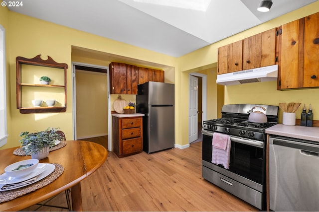 kitchen featuring stainless steel appliances and light wood-type flooring