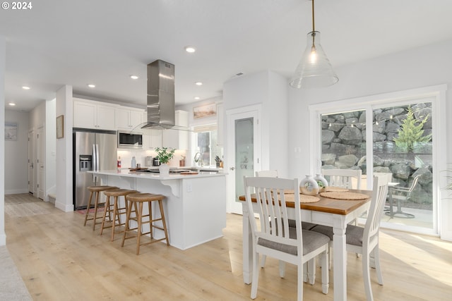 dining room with light wood-type flooring