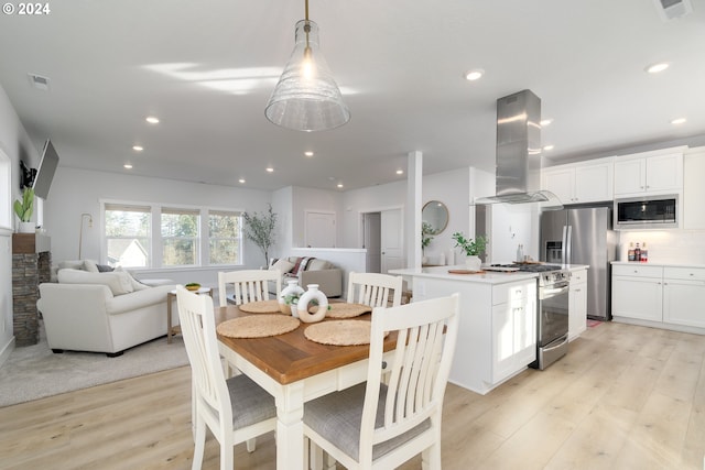 dining room with light hardwood / wood-style flooring