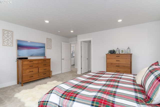 bedroom featuring light carpet