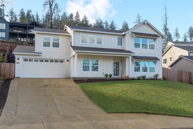 view of front of house featuring a garage and a front lawn