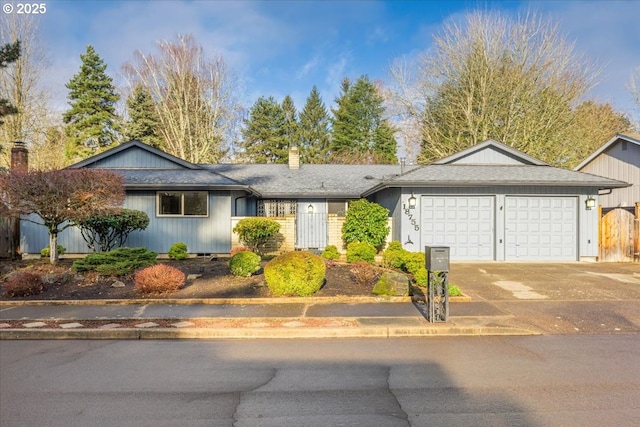 single story home featuring a garage