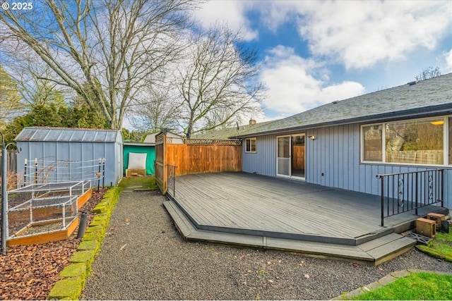 wooden terrace featuring a storage shed