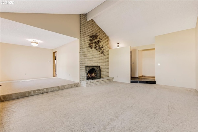 unfurnished living room featuring a fireplace, high vaulted ceiling, beam ceiling, and carpet flooring