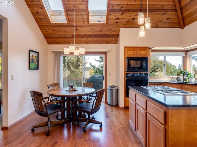 14355 NW Pheasant Hill Ln, Mcminnville, OR 97128 - dining space with wooden ceiling, a skylight, light wood-style floors, healthy amount of natural light, and a chandelier