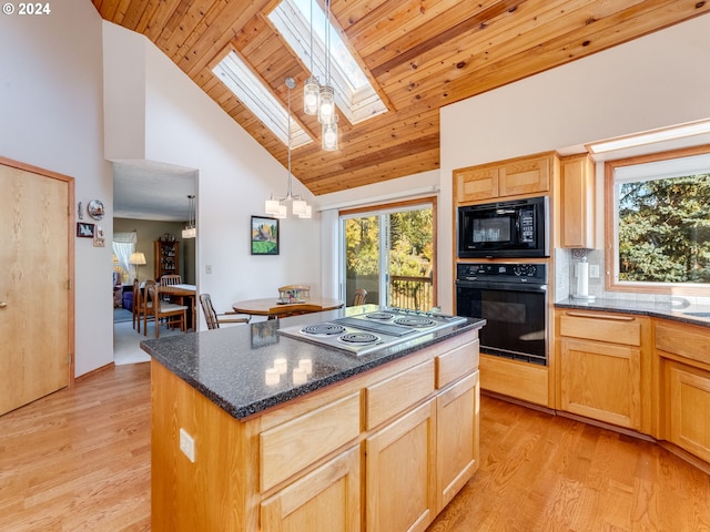14355 NW Pheasant Hill Ln, Mcminnville, OR 97128 - kitchen featuring black appliances, high vaulted ceiling, a skylight, light brown cabinetry, and light wood-type flooring