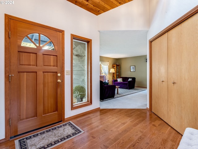 14355 NW Pheasant Hill Ln, Mcminnville, OR 97128 - entrance foyer with light wood-type flooring, baseboards, wooden ceiling, and high vaulted ceiling
