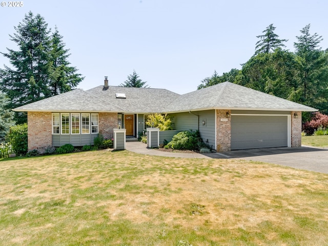 14355 NW Pheasant Hill Ln, Mcminnville, OR 97128 - ranch-style house featuring asphalt driveway, a garage, brick siding, and a front yard