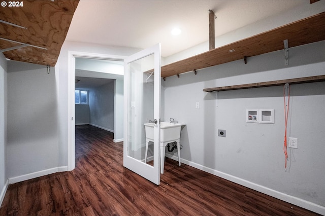 clothes washing area featuring electric dryer hookup, hookup for a washing machine, dark wood-type flooring, and sink