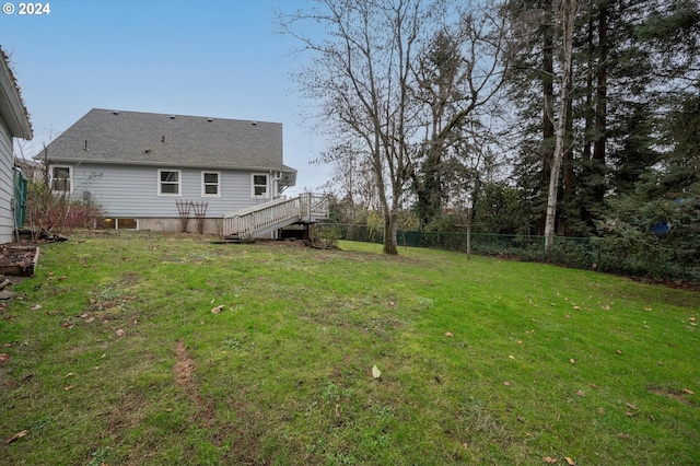 view of yard featuring a wooden deck