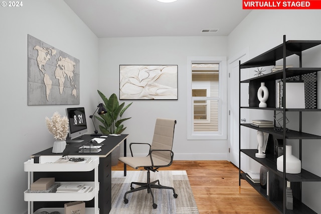 office space featuring light hardwood / wood-style floors