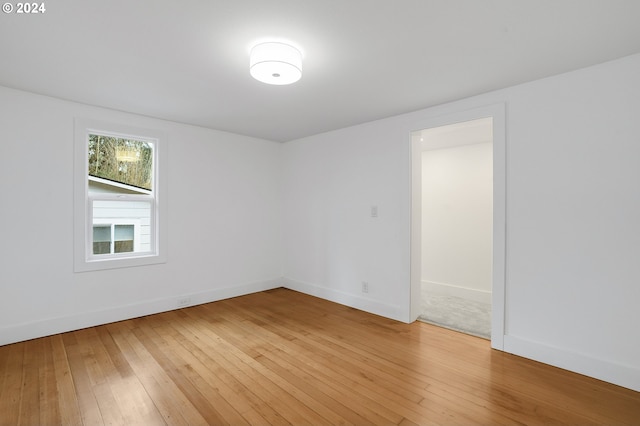 empty room featuring wood-type flooring