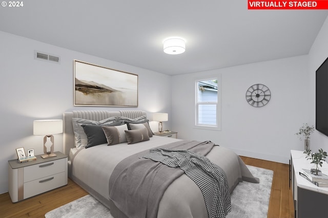 bedroom with light hardwood / wood-style flooring