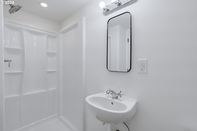 bathroom featuring sink and walk in shower