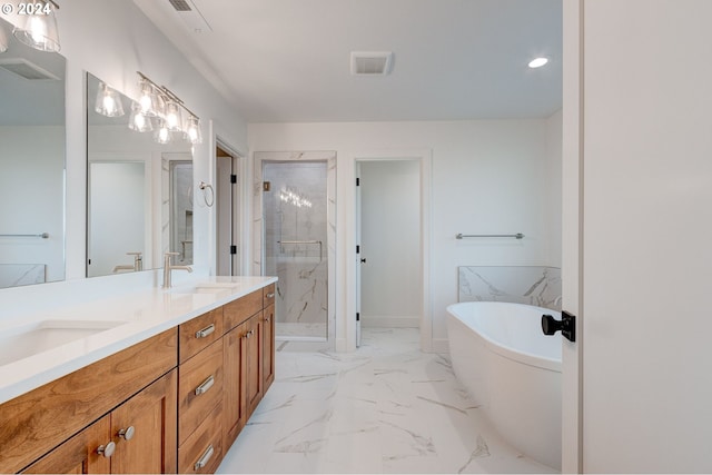 bathroom with vanity and separate shower and tub