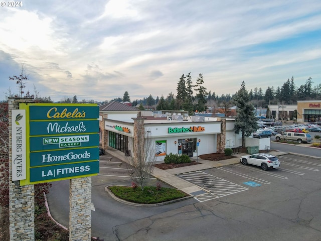 view of property featuring uncovered parking