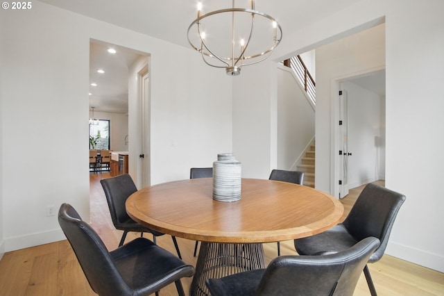 dining area with stairs, recessed lighting, a notable chandelier, and light wood-type flooring
