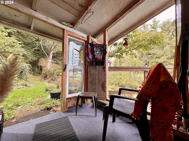 sunroom / solarium with vaulted ceiling