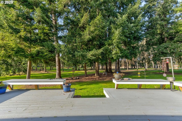 view of home's community featuring a deck and a lawn