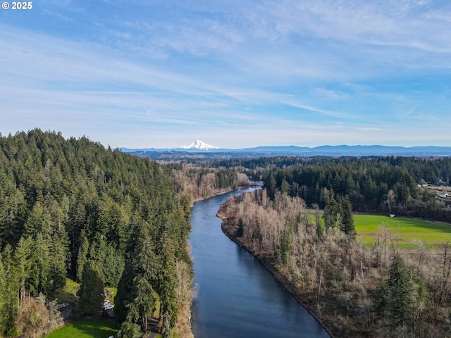 aerial view featuring a water and mountain view