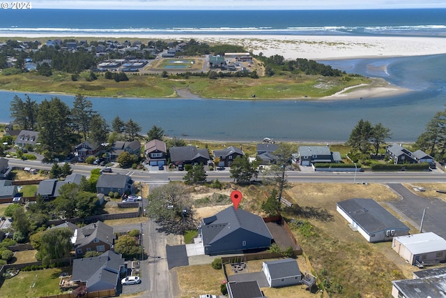 aerial view featuring a water view and a view of the beach