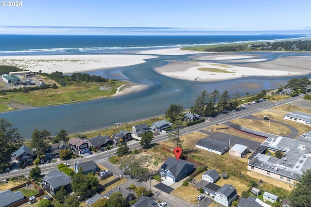 bird's eye view with a view of the beach and a water view