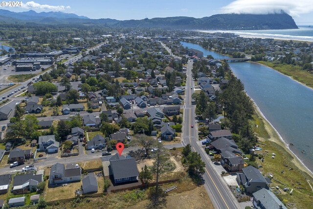 bird's eye view featuring a water and mountain view