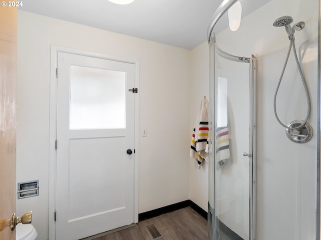 entrance foyer featuring visible vents and wood finished floors