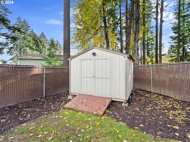 view of shed featuring a fenced backyard