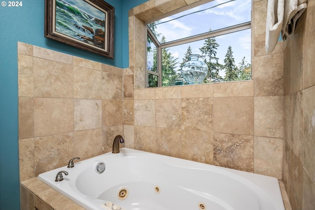 bathroom featuring tiled tub