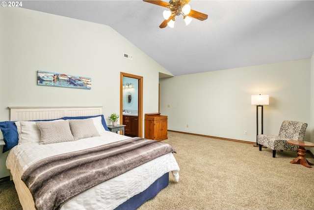 carpeted bedroom with ceiling fan, connected bathroom, and vaulted ceiling