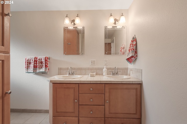 bathroom with tile patterned flooring and vanity