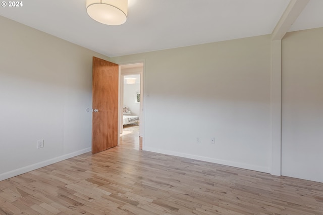 unfurnished room with light hardwood / wood-style floors