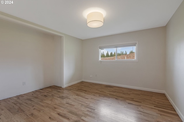 unfurnished room featuring light hardwood / wood-style flooring