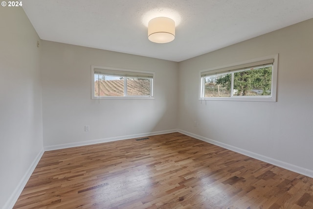 empty room featuring hardwood / wood-style floors